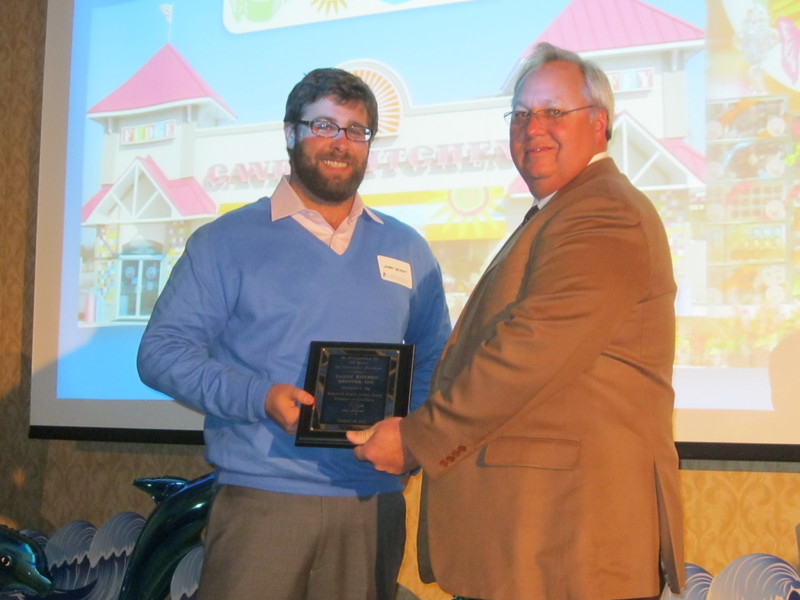 Candy Kitchen's Josh Leiner accepts the 50 Years in Business award from Bill Klemkowski at the Rehoboth Beach-Dewey Beach Chamber of Commerce's annual volunteer recognition and officers' installation dinner Jan. 24. Candy Kitchen started in Ocean City in 1937 and has been in Rehoboth Beach since 1963. BY RYAN MAVITY